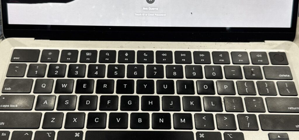 MacBook with cracked MacBook with cracked, bleeding LCD screen