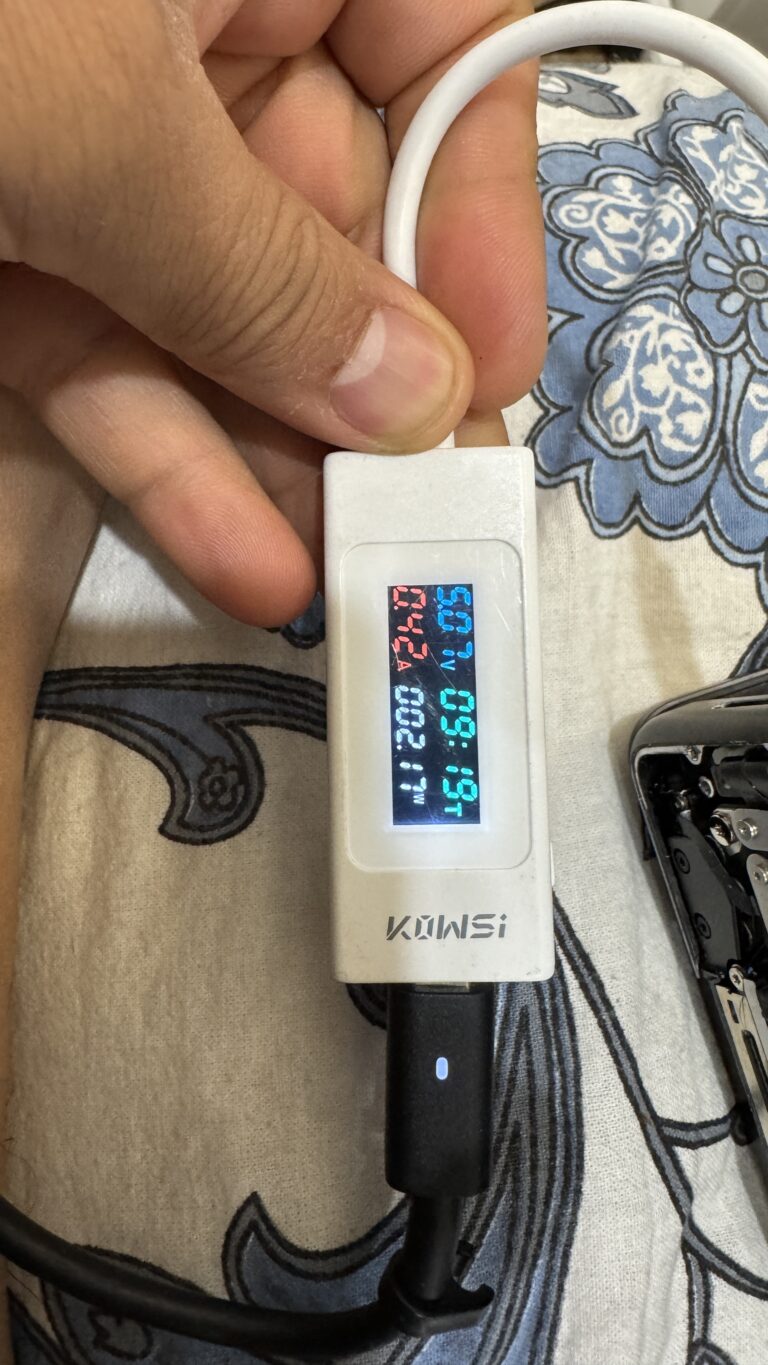 USB-C power meter testing a laptop charging port