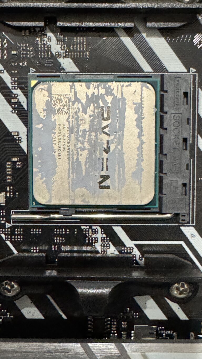 AMD Ryzen CPU with dried thermal paste before cleaning