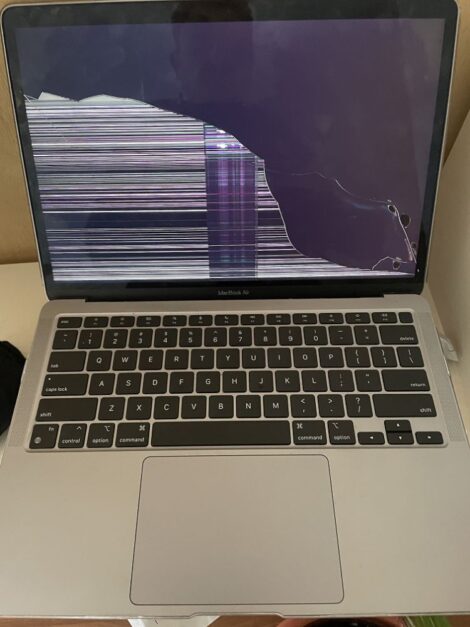 MacBook Air with cracked, damaged screen